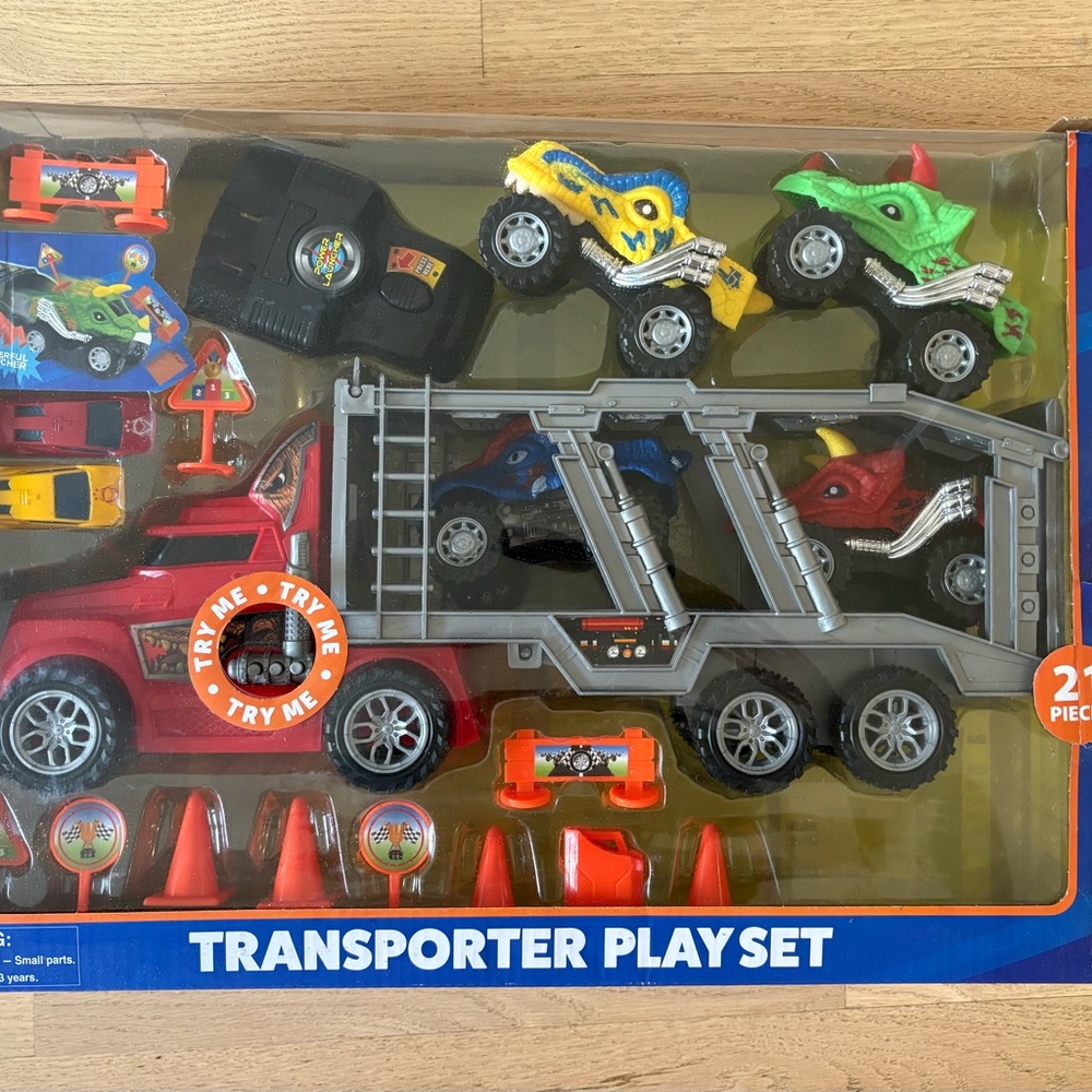 Transporter Truck Play Set with Multi-Colored Monster Trucks plus Launcher